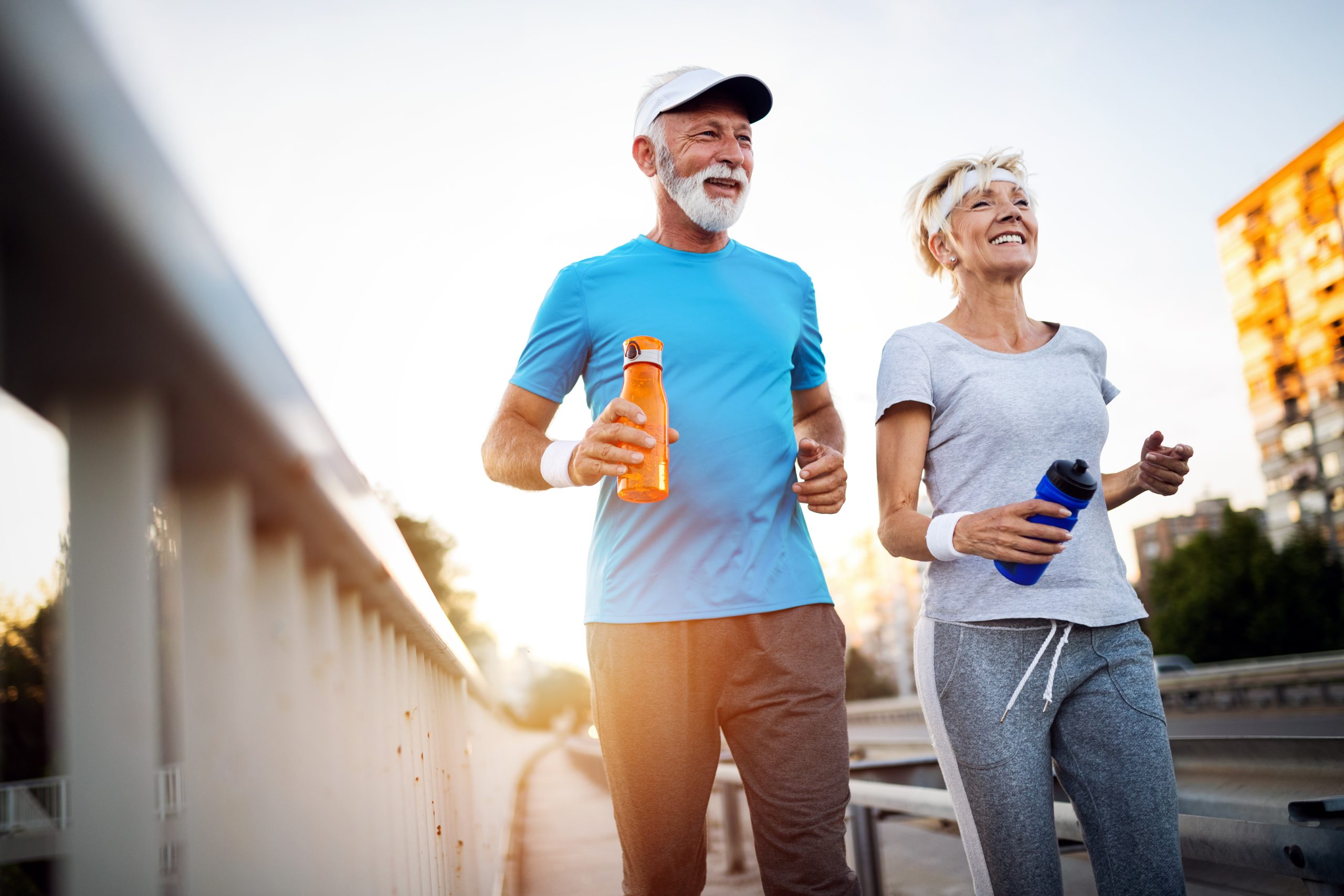 Two happy elderly people, one man and one woman, enjoying their day without chronic cough