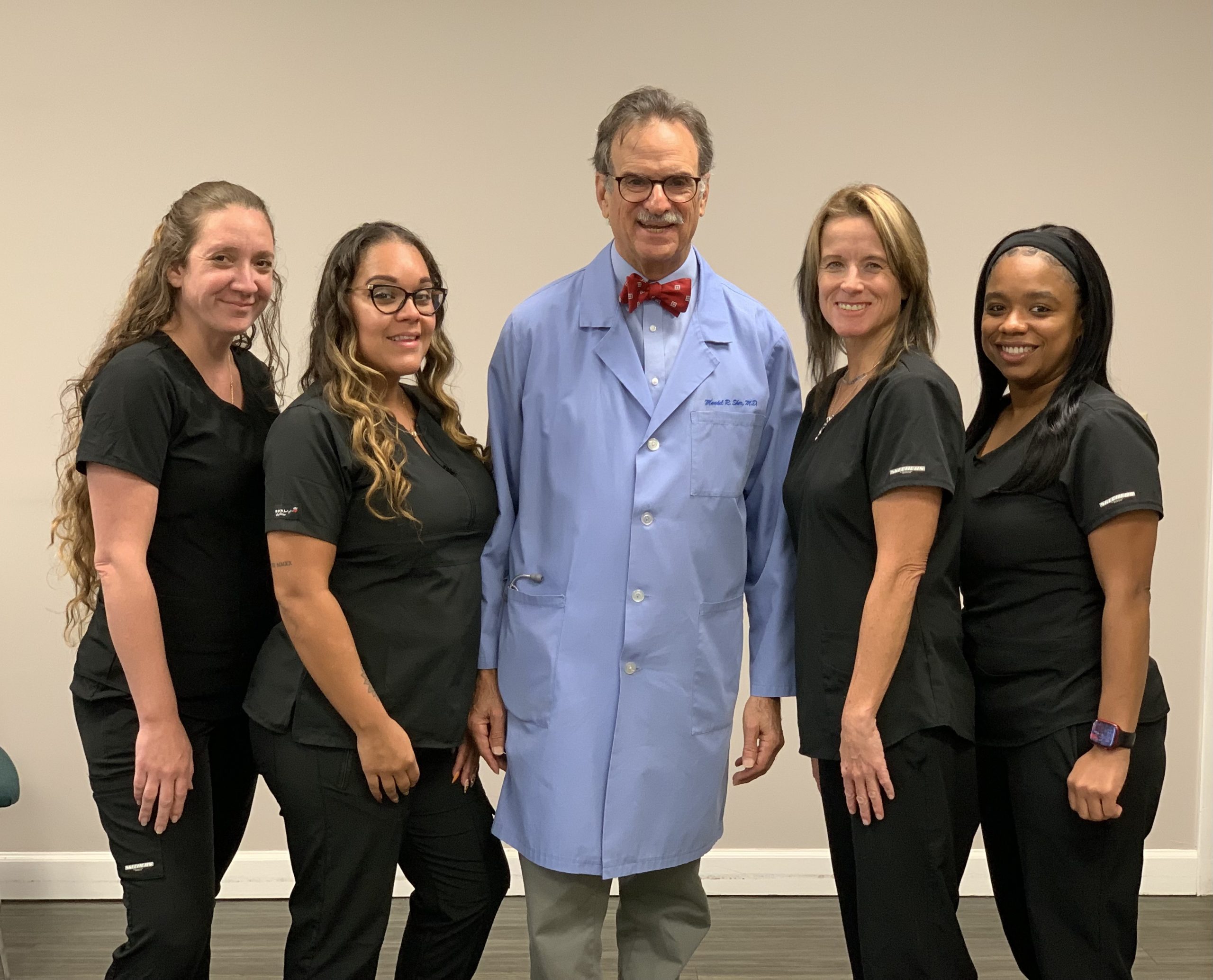 A group photo a Dr. Mandel and the Center For Cough team.